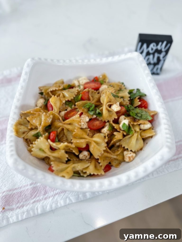 Whisking the balsamic vinaigrette until fully combined.