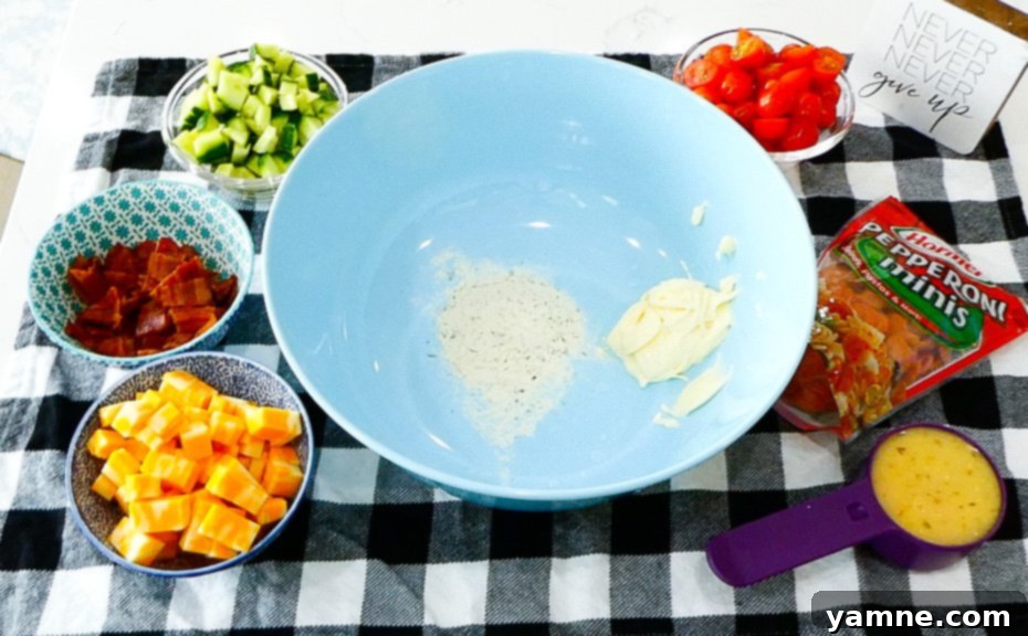 Tuscan Ranch Pasta Salad 5 Diced cucumber and cherry tomatoes for the pasta salad.