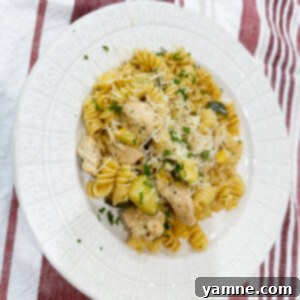 Delicious Lemon Butter Chicken with Pasta, garnished with fresh herbs