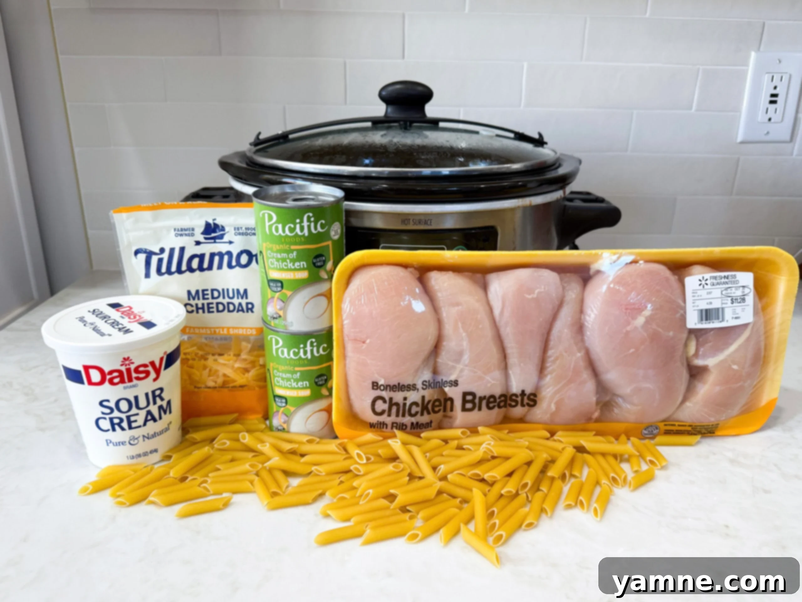 Easy Slow Cooker Creamy Rotel Chicken Pasta 5 Ingredients for creamy Rotel chicken pasta on counter ready for assembly