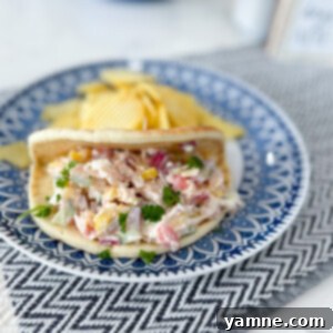 Fresh Chicken Vegetable Pitas served on a wooden board