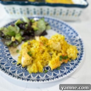 Hearty Cheesy Chicken and Yellow Rice Casserole, baked to perfection