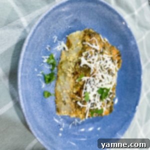 Crockpot Spinach and Egg Comfort Bake 2 A freshly made Slow Cooker Spinach Egg Casserole, golden and bubbly, garnished with fresh herbs and ready to serve.