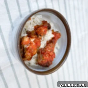 Delicious Slow Cooker Salsa Chicken served over a bed of rice