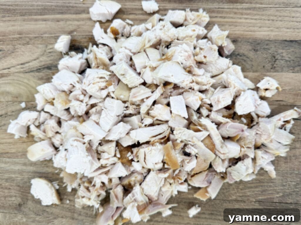 Sweet potatoes and onions sizzling in a large pan