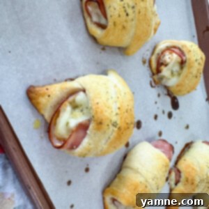 Chicken Cordon Bleu Pockets on a plate, garnished with fresh parsley.