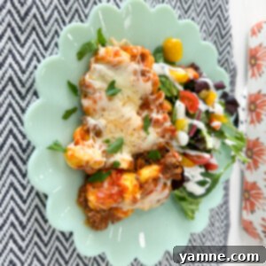 Cheesy Tortellini Bake 2 A deliciously cheesy tortellini casserole, bubbling with cheese and sauce