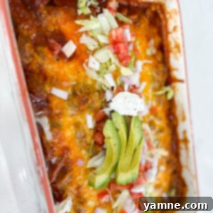 A deliciously cheesy Enchilada Meatball Casserole, ready to serve