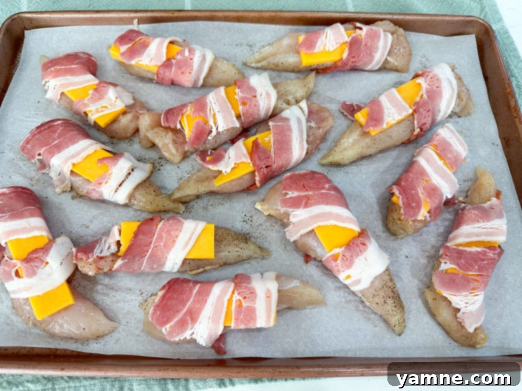 Bacon-Wrapped Chicken Bites: A 3-Ingredient Wonder 5 Bacon wrapped chicken on baking sheet