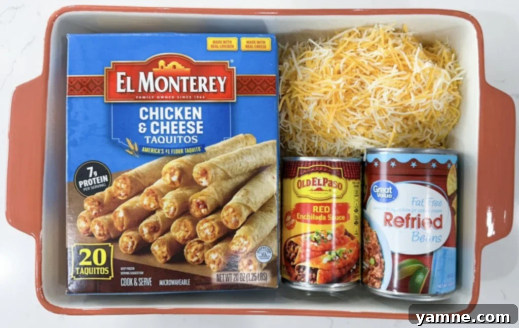 Close-up of fresh ingredients for Dump and Go Taquito Casserole including taquitos, beans, sauce, and cheese