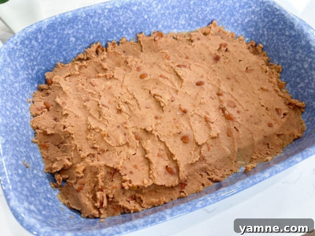 Greasing a 9x13 baking dish for taquito casserole