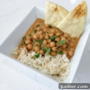 Easy 10-Minute Peanut Butter Curry 3 Close-up of a bowl of creamy 10-minute peanut butter curry, garnished with fresh cilantro.