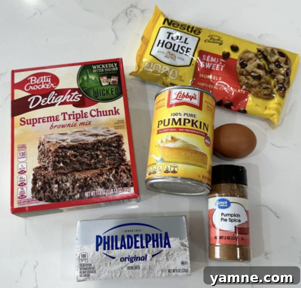 Swirled Pumpkin Cheesecake Brownies 2 Freshly mixed pumpkin cheesecake brownie batter ready for layering.