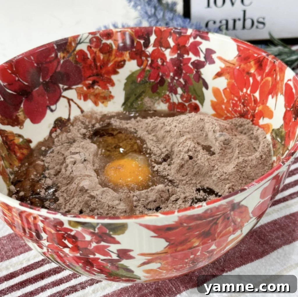 Swirled Pumpkin Cheesecake Brownies 3 A baking dish lined with parchment paper, ready for brownie batter.