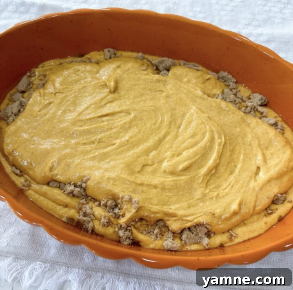 Spiced Pumpkin Honey Bun Cake 6 Brown sugar sprinkled over the first cake layer, ready for the top layer.