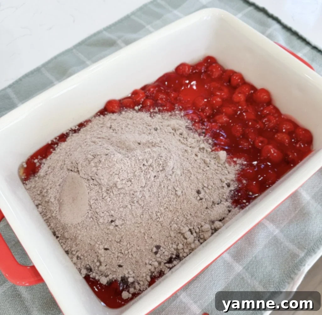 Chocolate cake mix layered over cherry pie filling