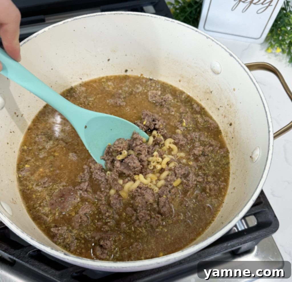 One-Pan Homemade Cheeseburger Pasta 4 Draining grease from browned beef