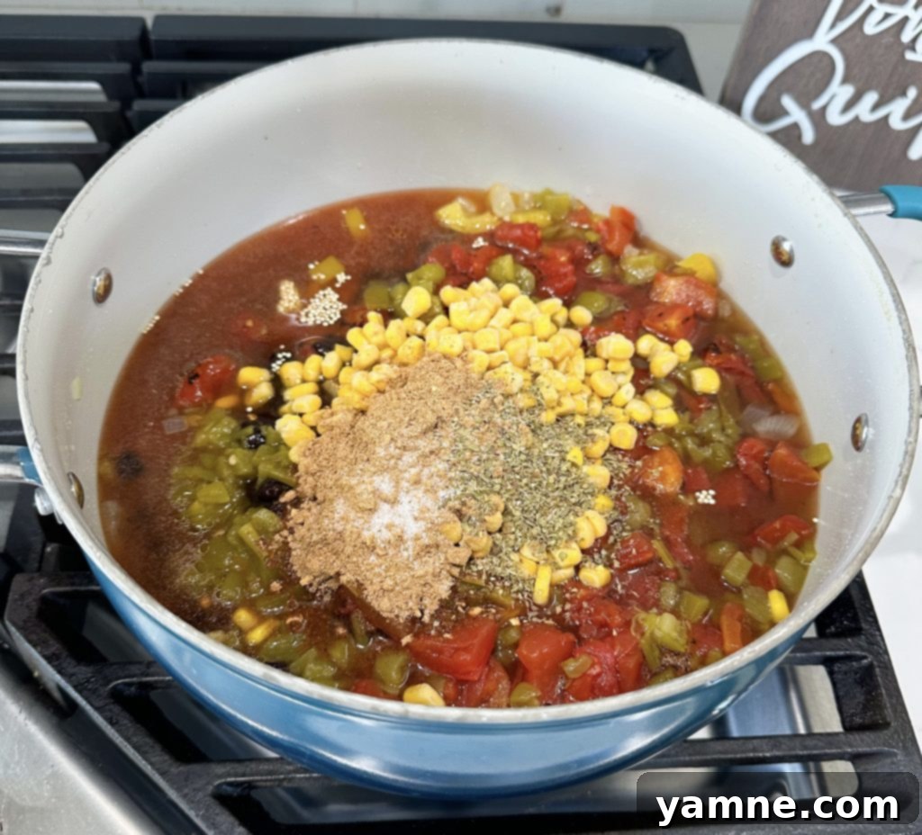 adding garlic to meatless taco skillet