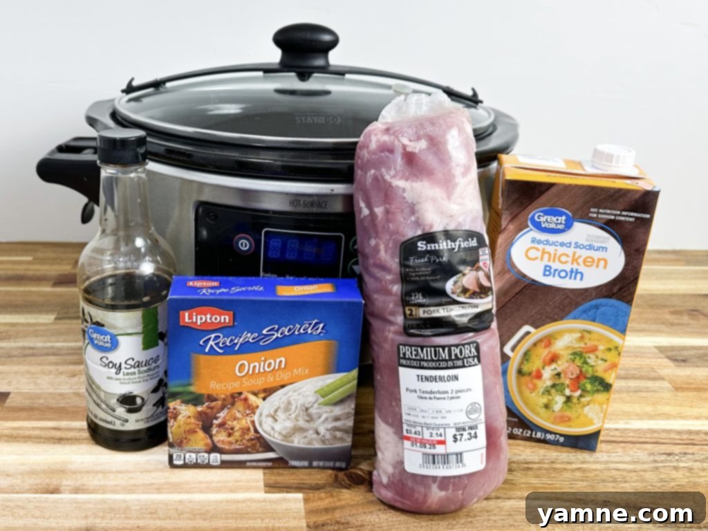 Uncooked pork tenderloin with seasonings in a slow cooker