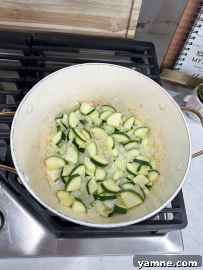 One pot orzo with vegetables sauteing vegetables