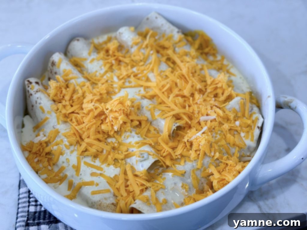 Honey-Glazed Lime Chicken Enchiladas 5 Mixing green enchilada sauce and heavy cream for creamy topping