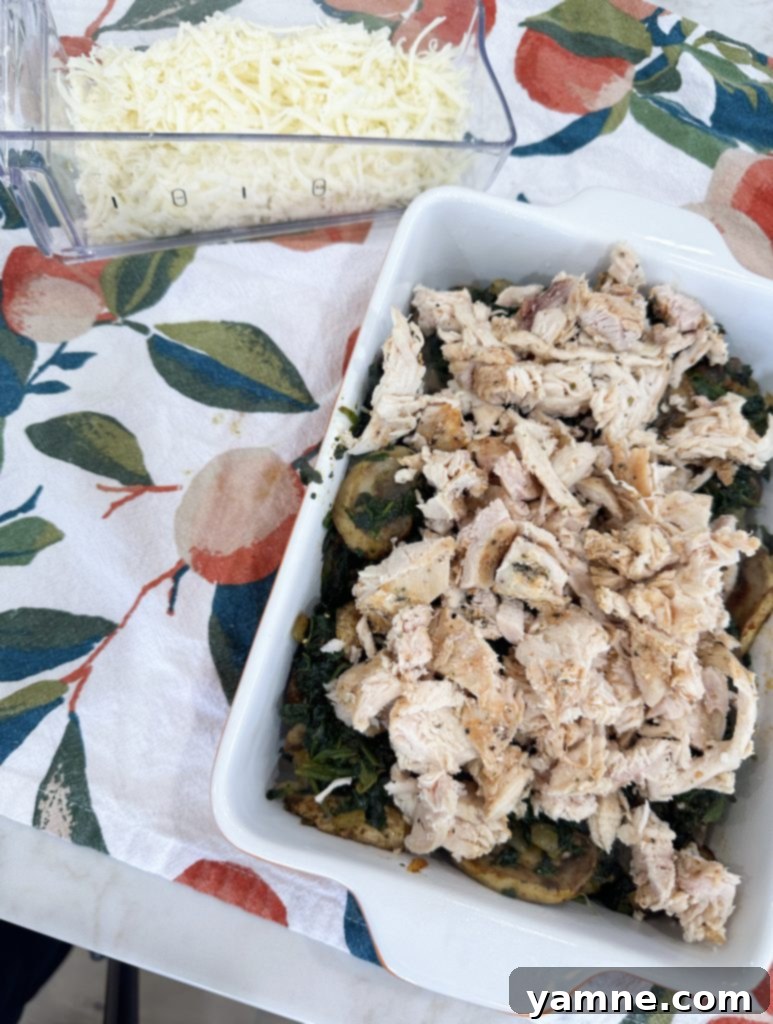 Wholesome Chicken Bake 3 Layering vegetables in the baking dish for chicken casserole