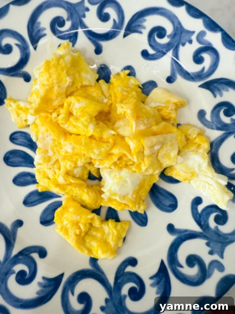 Scrambled eggs cooking in a pan