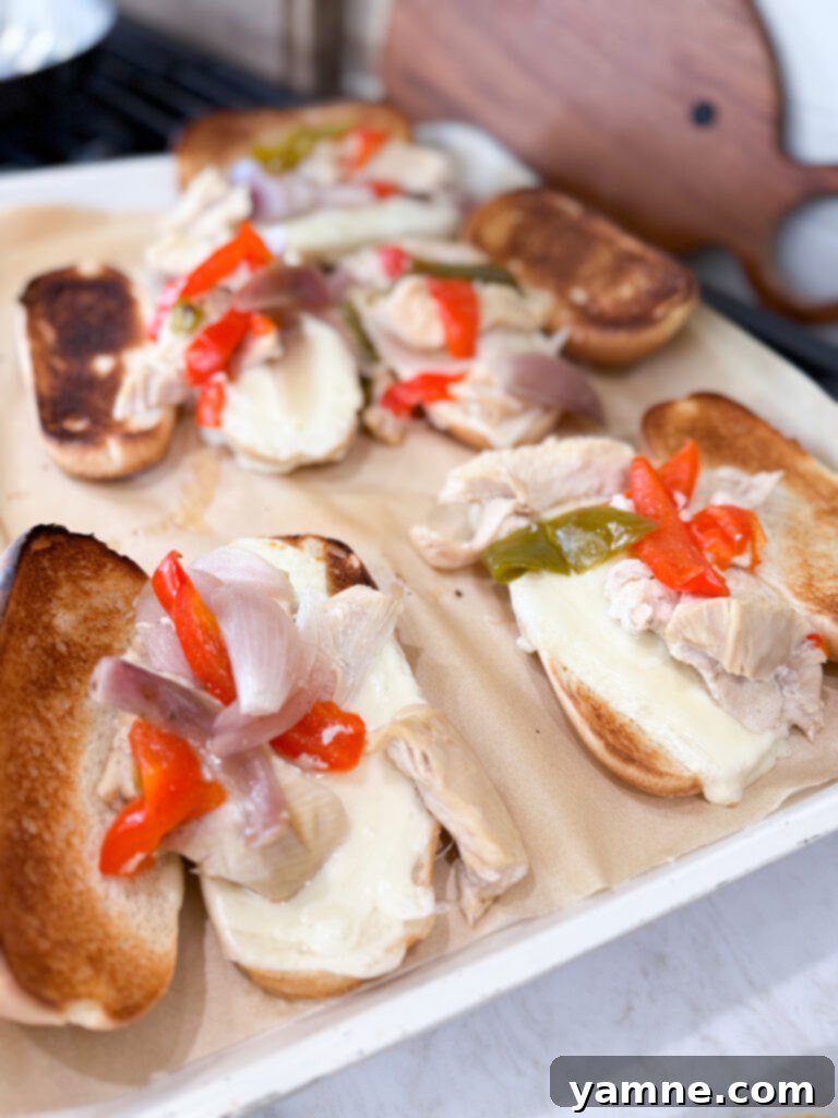 Easy and satisfying chicken cheesesteak sandwiches broiled to perfection