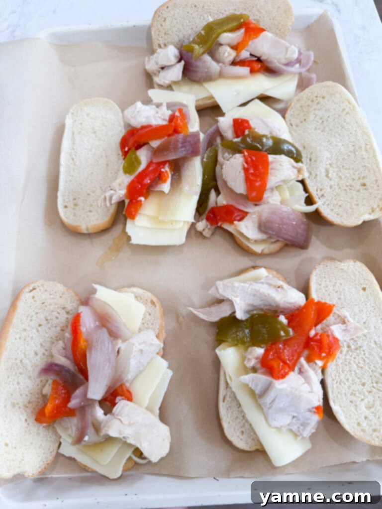 Assembling the best chicken and veggie sandwiches with a slotted spoon