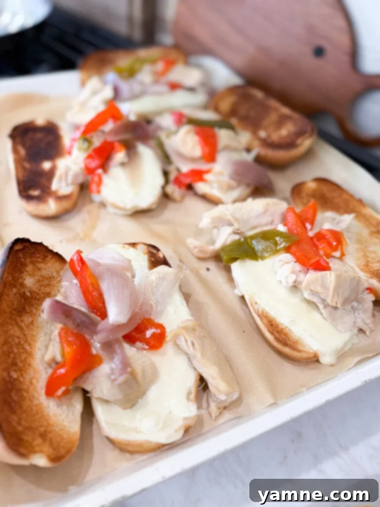 Easy and satisfying chicken cheesesteak sandwiches broiled with melted cheese