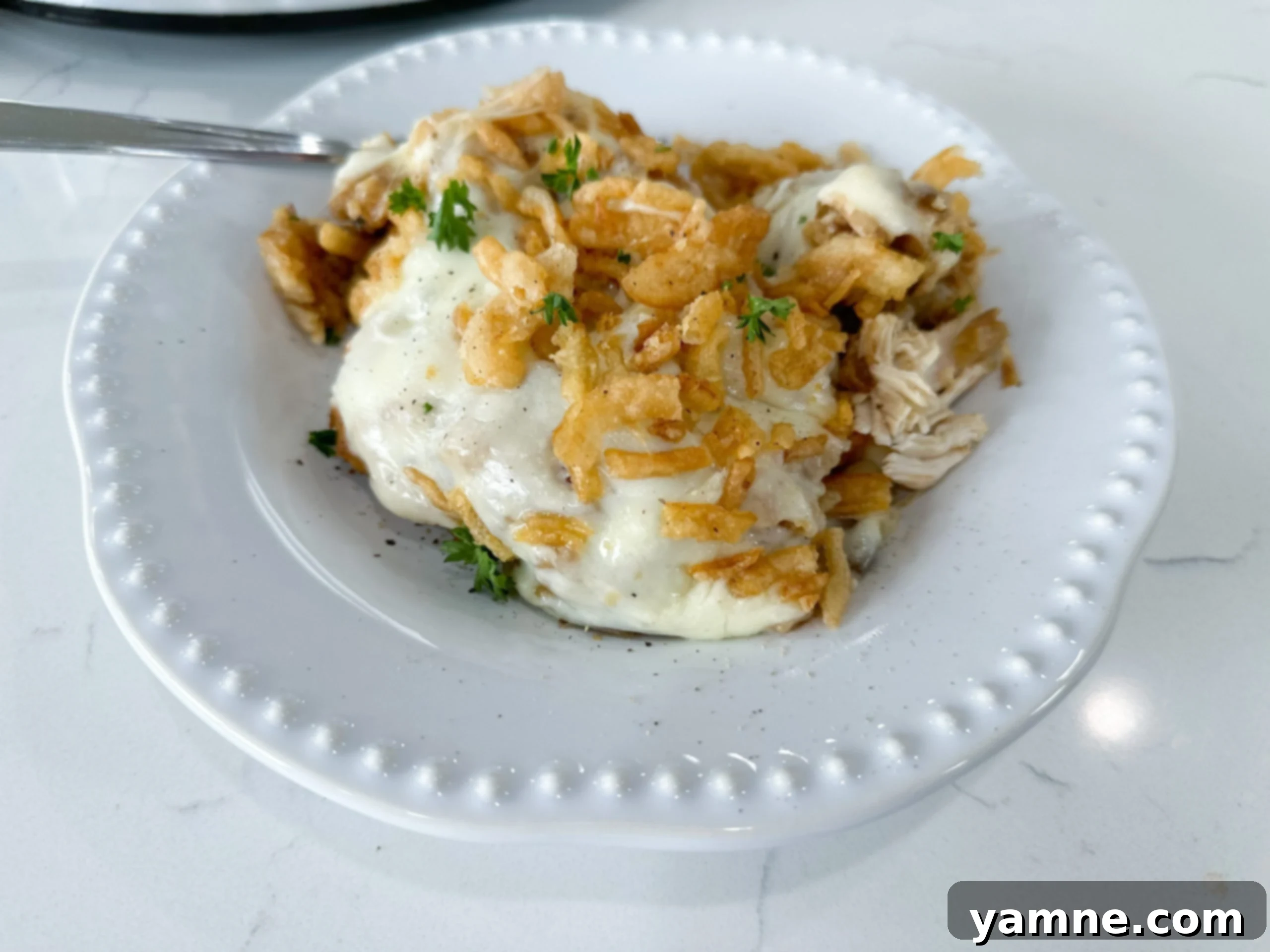 Delicious Slow Cooker French Onion Chicken with creamy cheese and rice