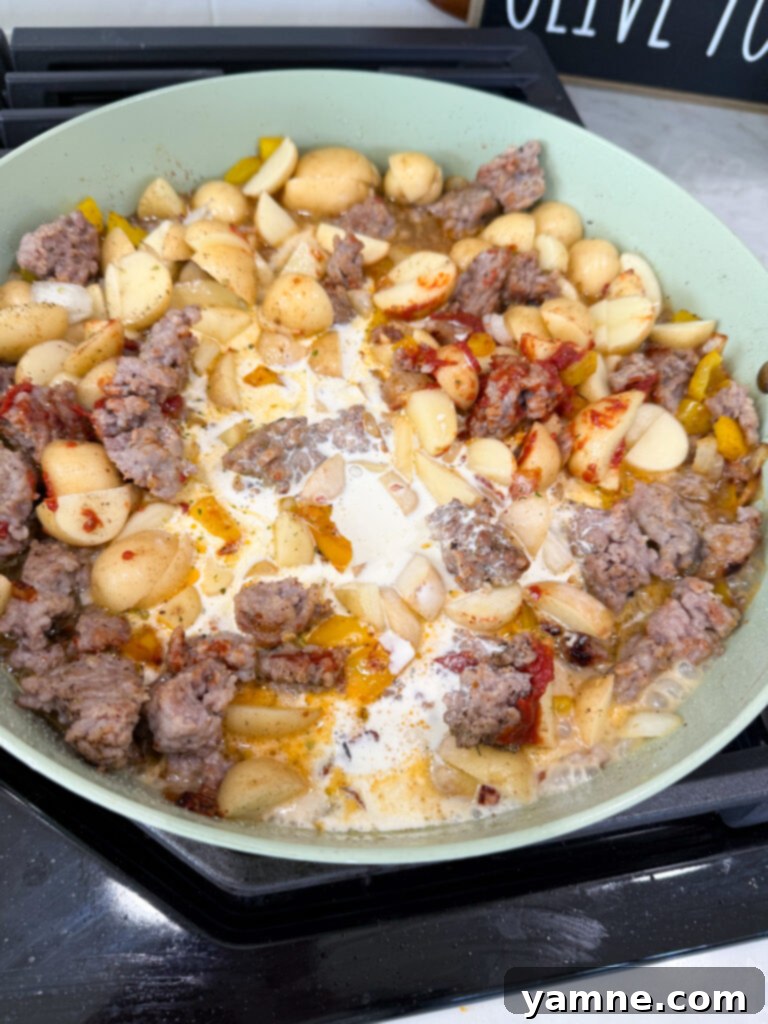 Pour cream into skillet