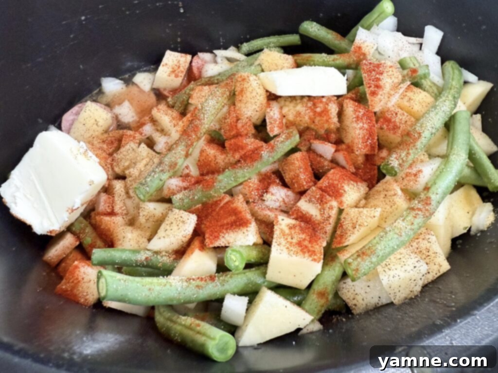 Kielbasa sausage, potatoes, and green beans seasoned in a slow cooker