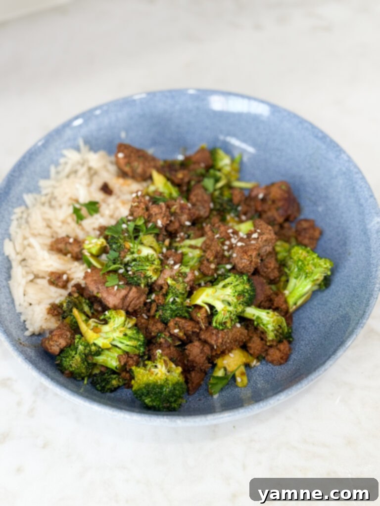 Cook Sweet & Spicy Turkey and Broccoli Bowl Recipe in a blue bowl on a white counter