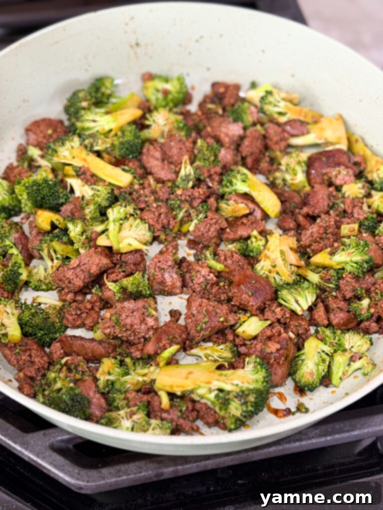 Cook broccoli and ground turkey in a large skillet with seasoning