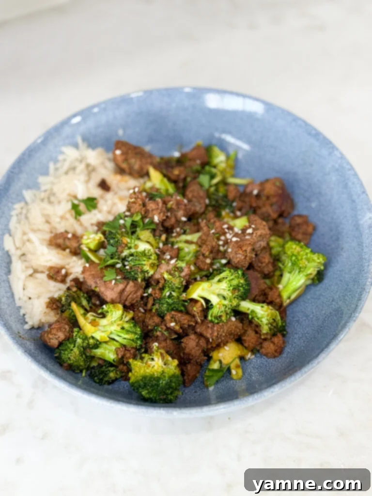 Cook Sweet & Spicy Turkey and Broccoli Bowl Recipe in a blue bowl on a white counter