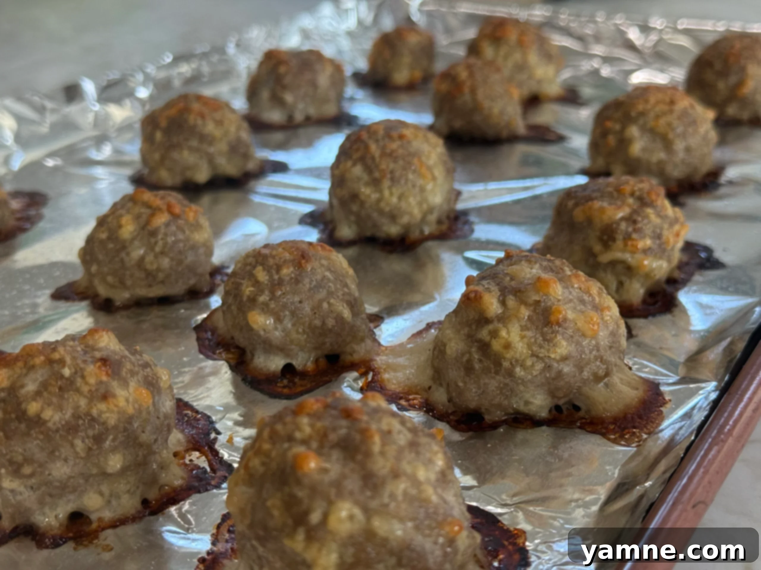 Close-up of cooked turkey meatballs on a baking sheet
