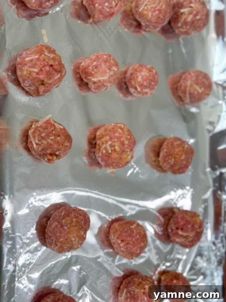 Close-up of cooked turkey meatballs on a baking sheet