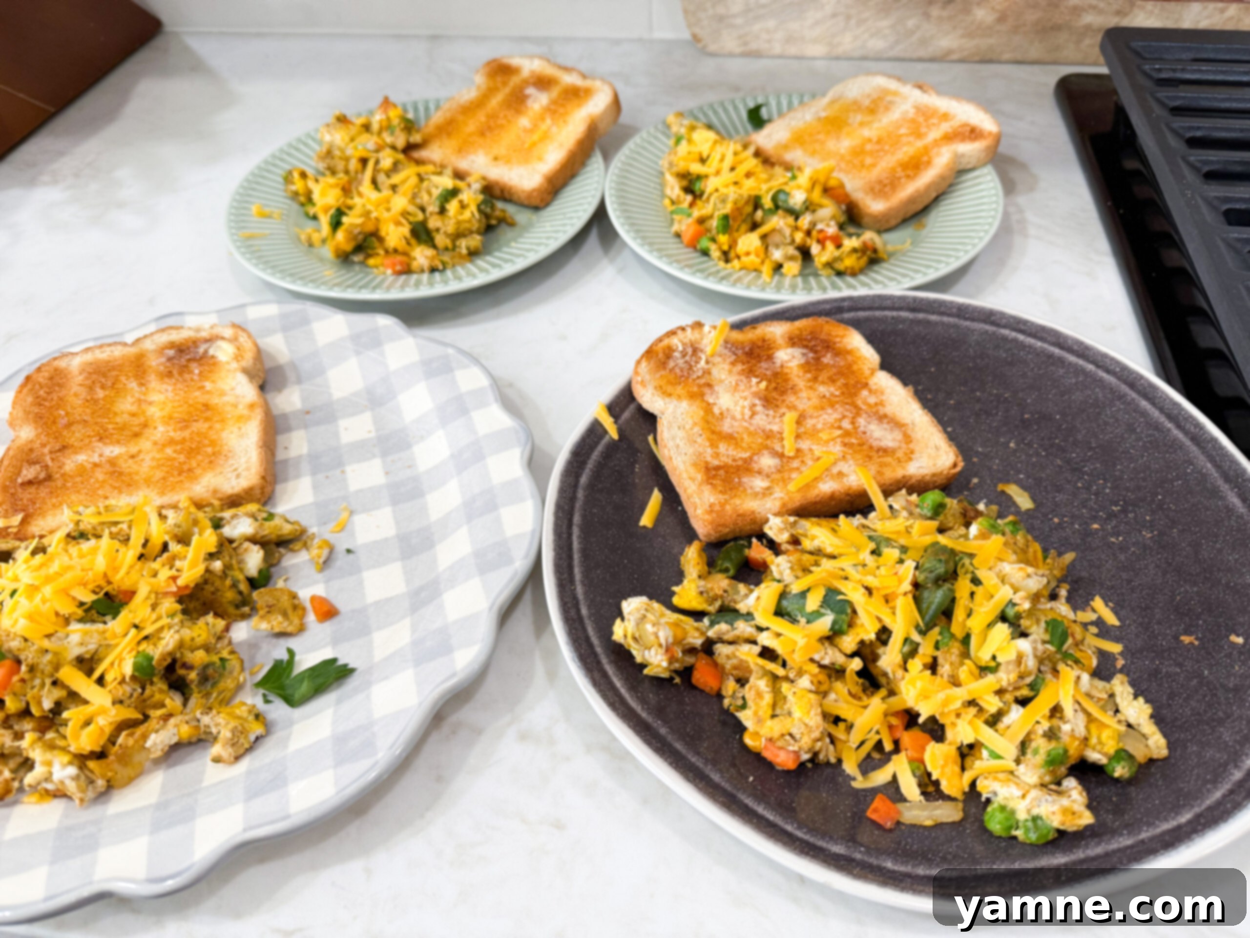 Egg and vegetable stir-fry plates. Recipe in meal plan.