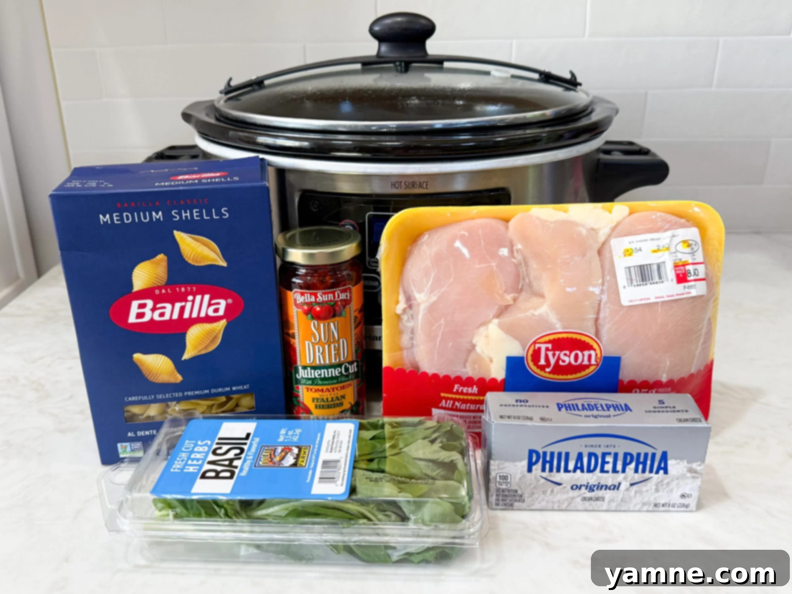 All the fresh ingredients for Marry Me Chicken Soup laid out neatly on a kitchen counter.
