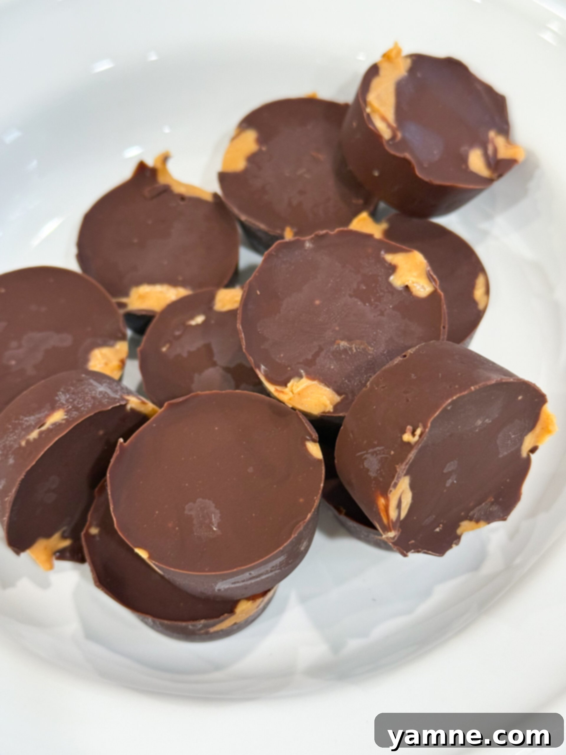 8 Magical 3-Ingredient Recipes for Easy Dinners and Delicious Treats 11 Homemade chocolate peanut butter cups in mini liners.