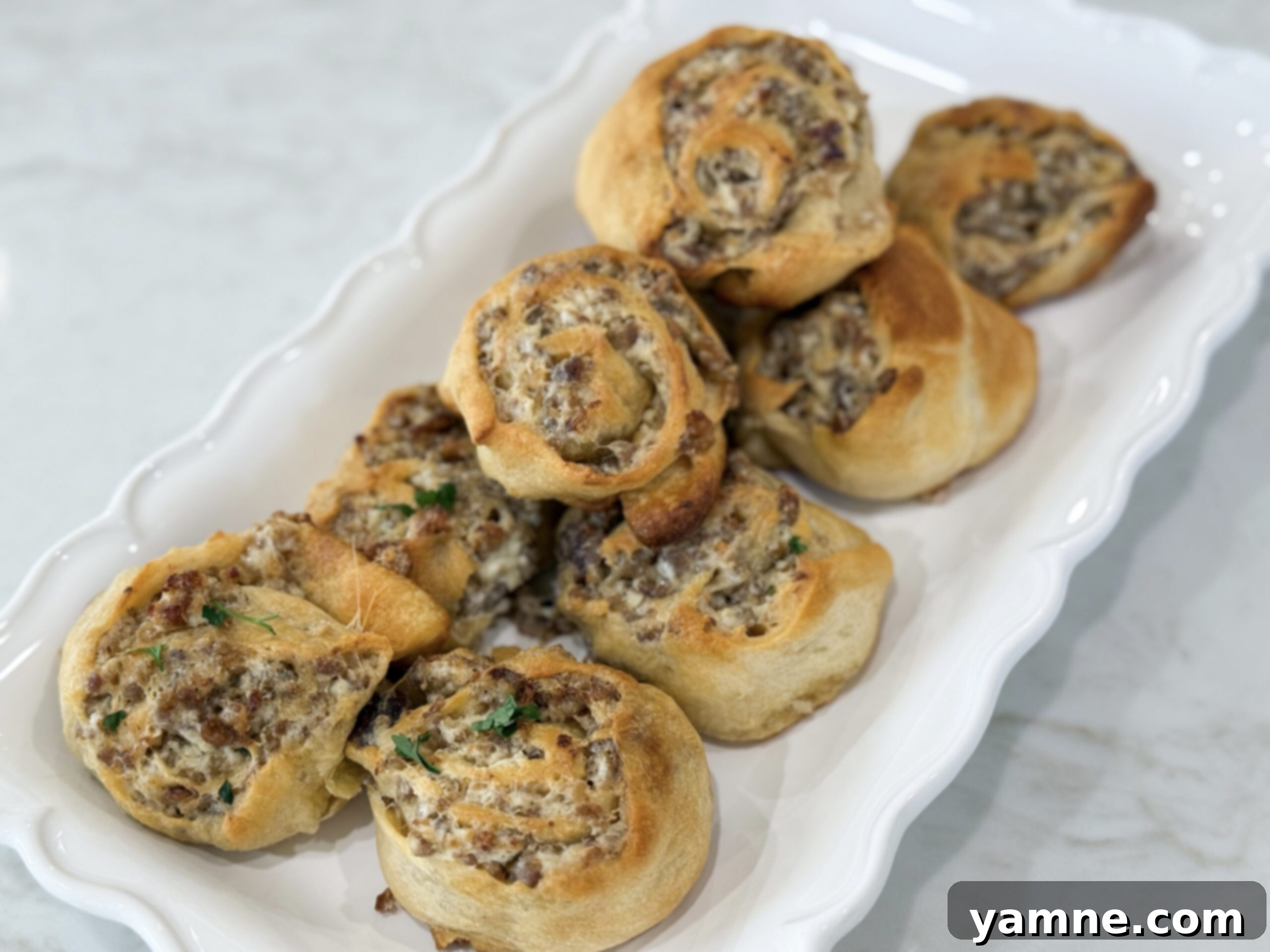 8 Magical 3-Ingredient Recipes for Easy Dinners and Delicious Treats 12 Golden sausage cream cheese pinwheels fresh from the oven.