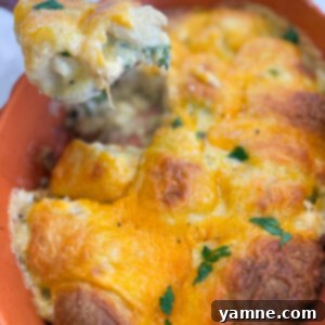 Flaky Cheesy Chicken and Broccoli Bake 11 Golden brown cheesy chicken crescent roll casserole baked in a pan, bubbling with melted cheese and flaky crust.