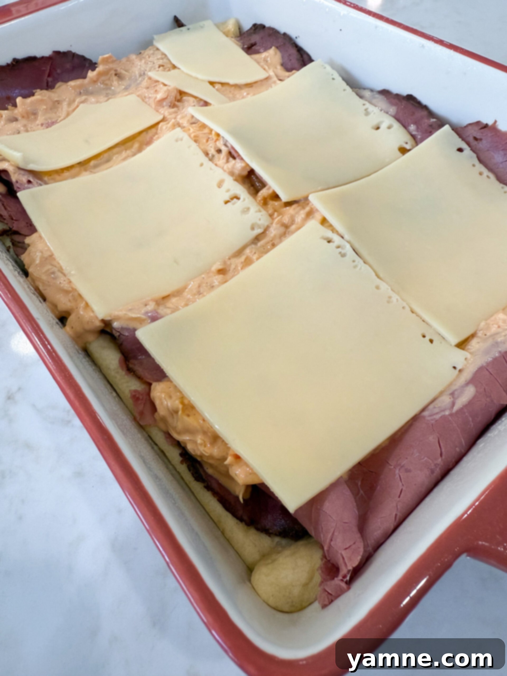 Pastrami Swirl Bake 8 Layering remaining Swiss cheese