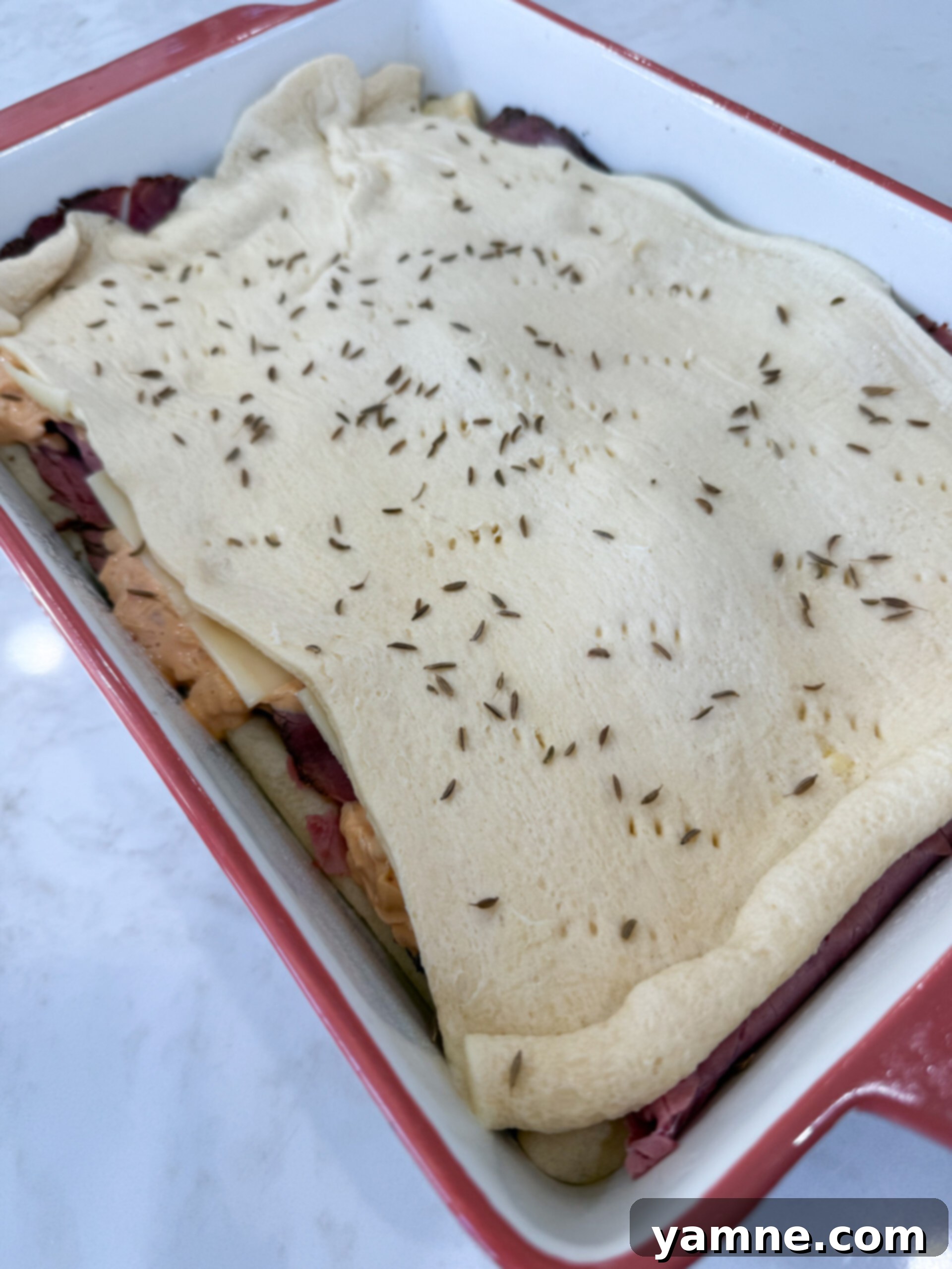Pastrami Swirl Bake 9 Adding second crescent dough sheet