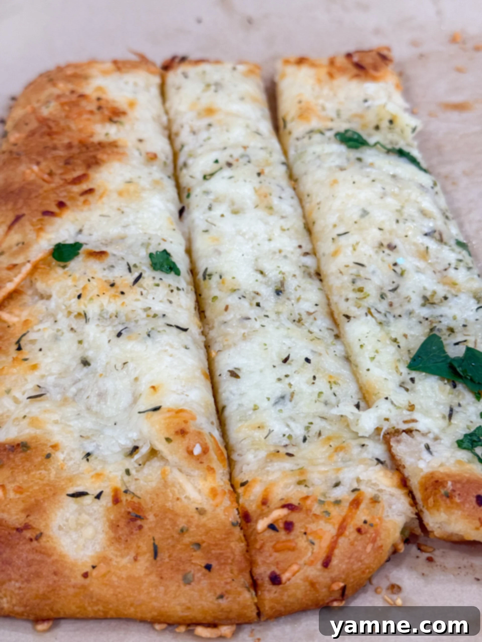 Golden baked cheesy garlic bread made with crescent dough
