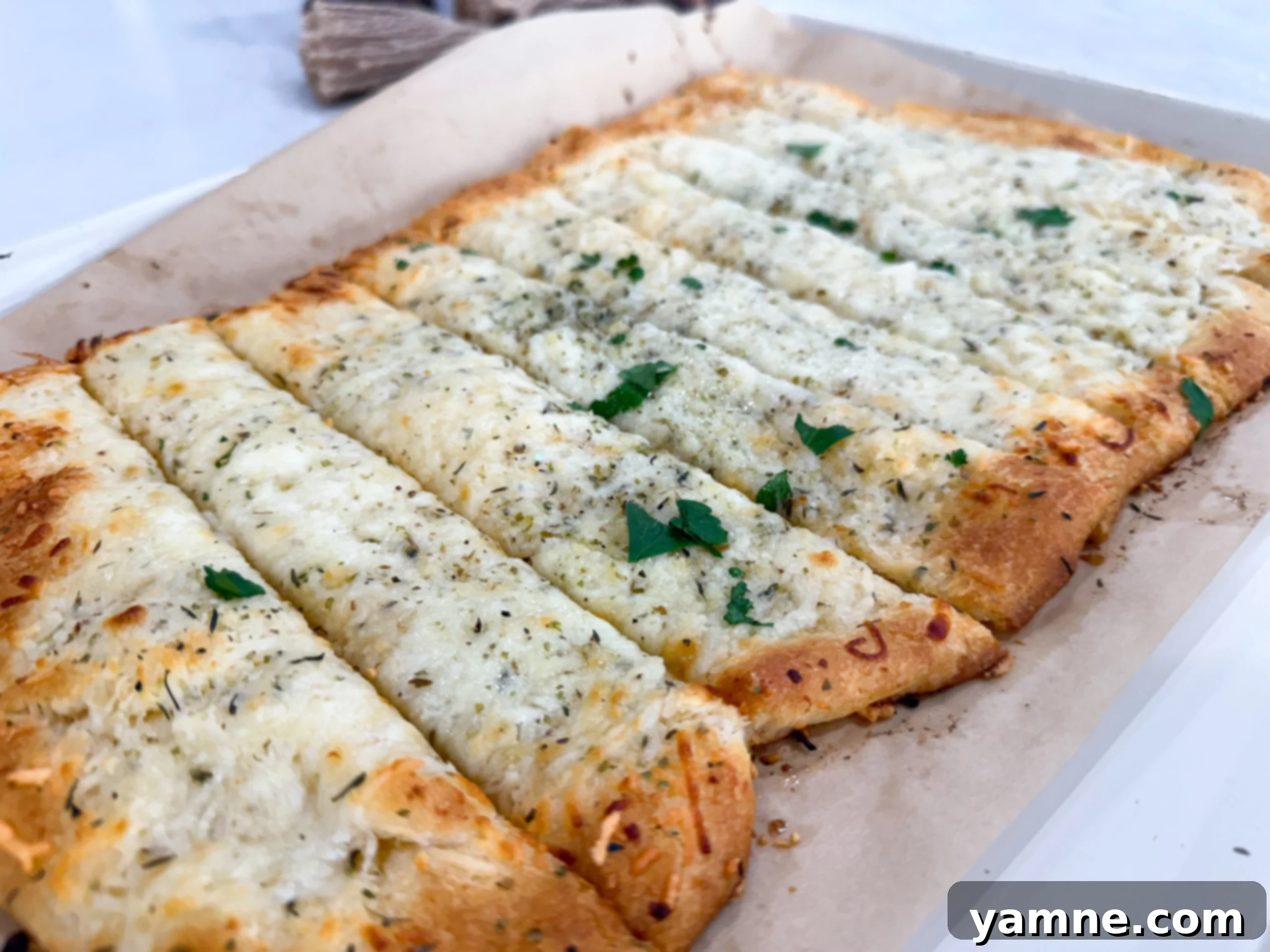 Golden baked cheesy garlic bread made with crescent dough