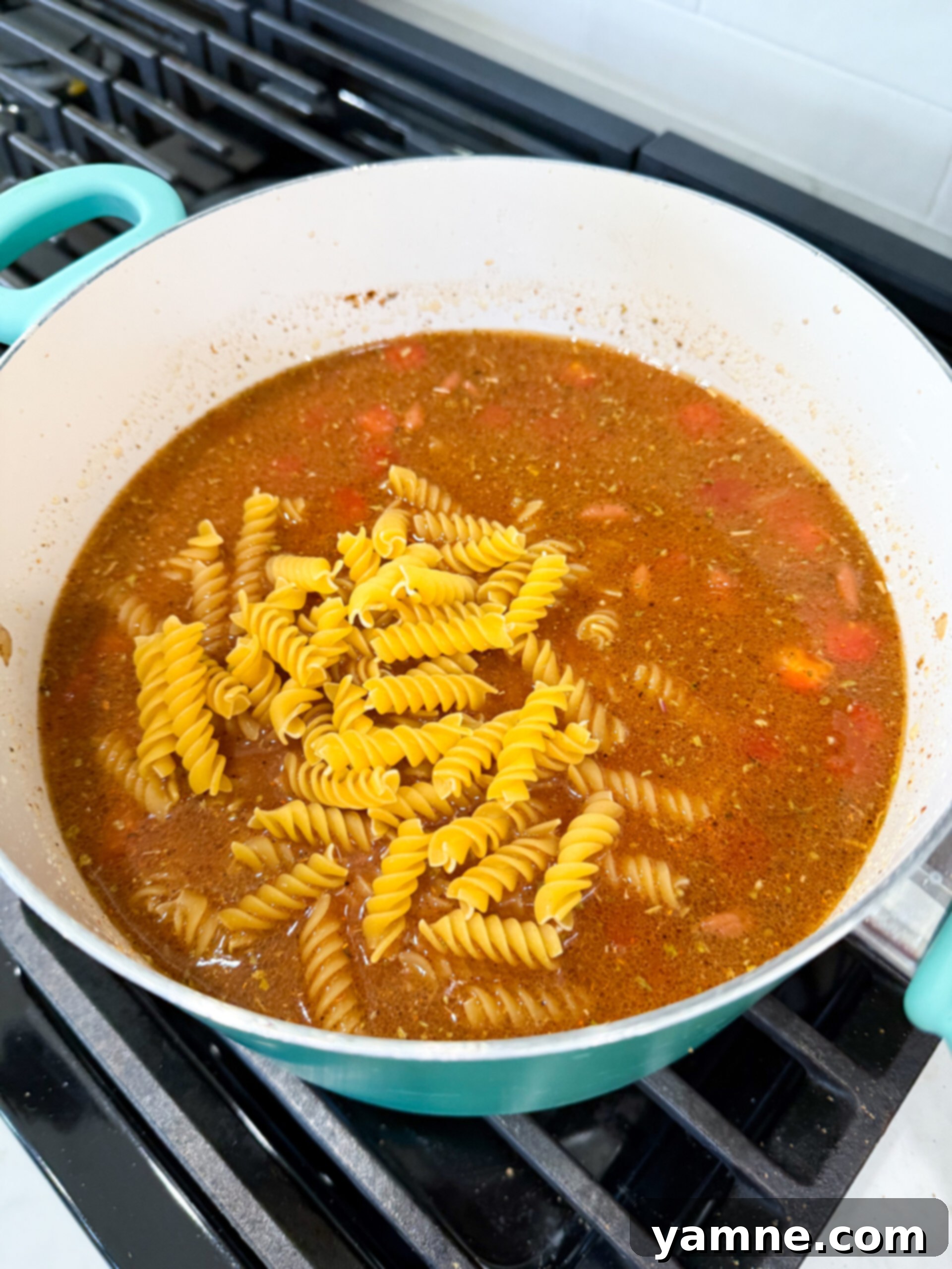 Adding ingredients to the browned beef
