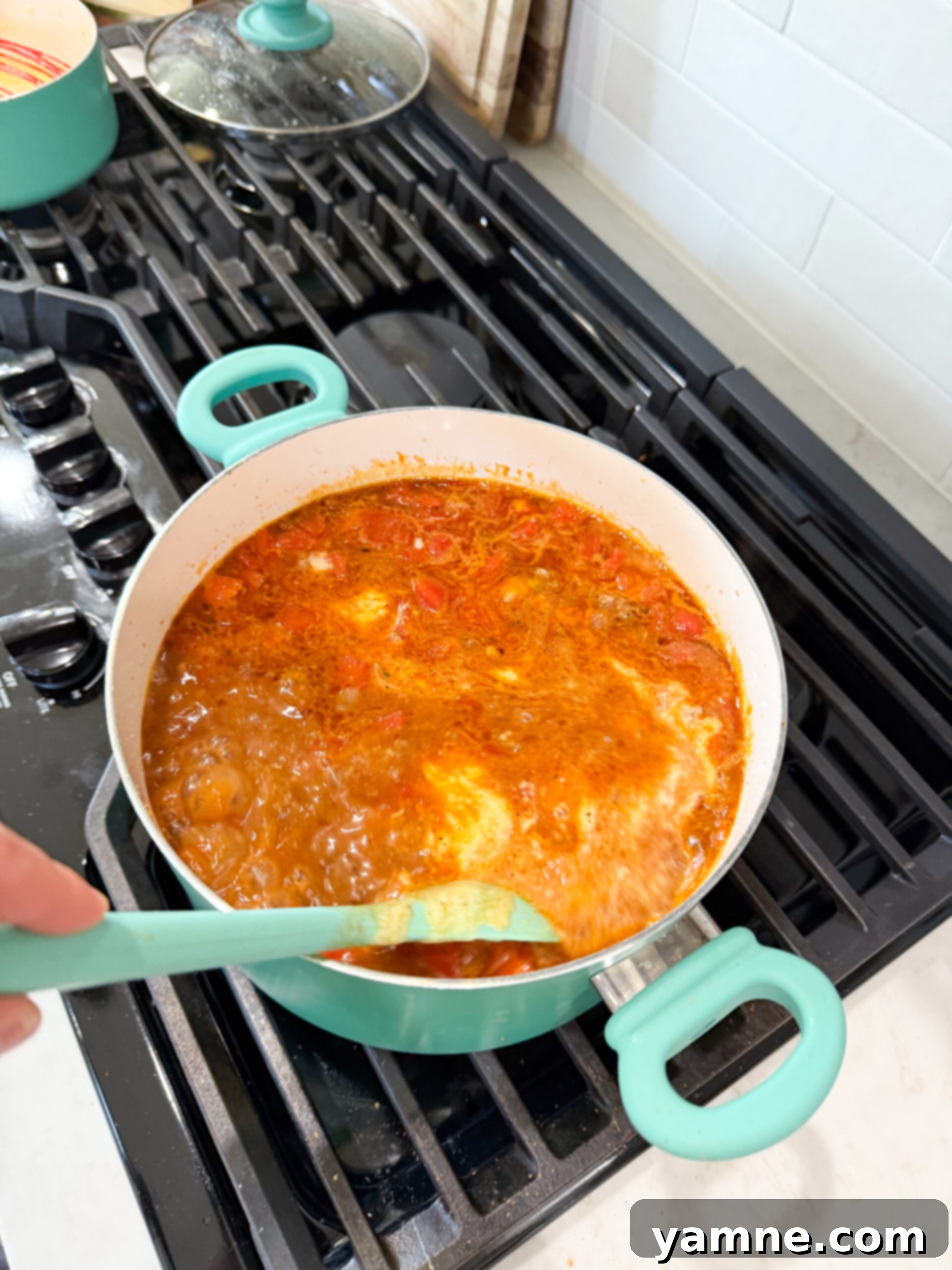 Making the cheddar cheese queso