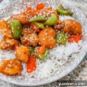 Tangy Glazed Chicken 2 Crispy Sweet and Sour Chicken with colorful bell peppers